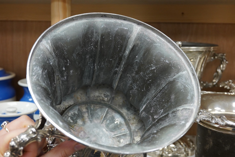 A pair of Old Sheffield plate two handled plated wine coolers, with later associated liners, 26cm high. Condition - fair